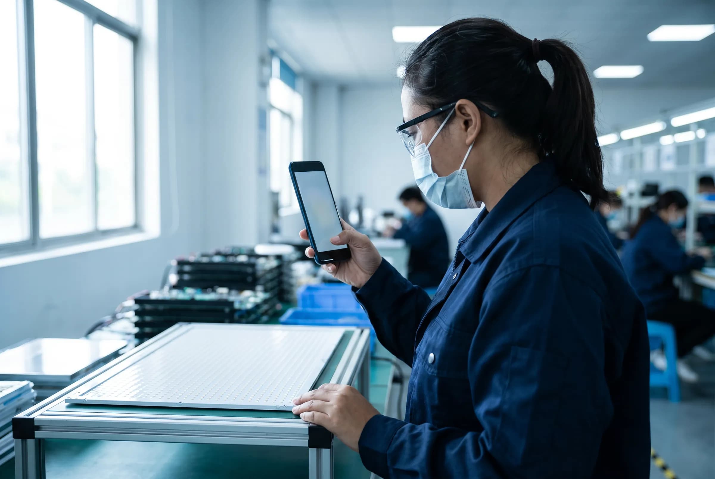 Auditor capturing inspection evidence on a smartphone